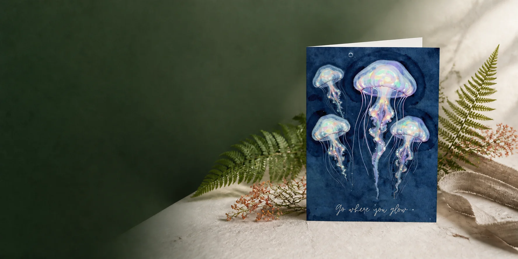 Go Where You Glow jellyfish printable card in a botanical studio setting