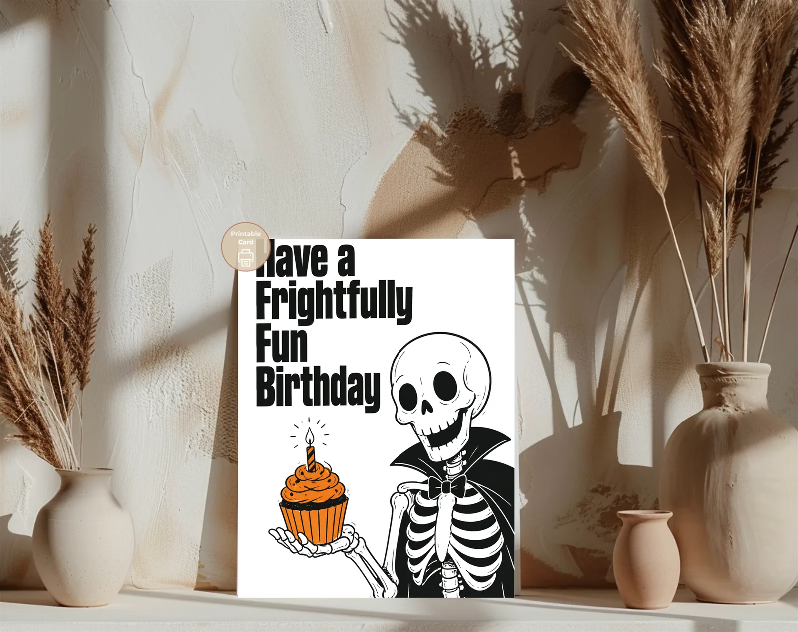 Alternative styled mockup of the design: Make their birthday deliciously spooky with a frightfully fun skeleton serving an orange cupcake in bold gothic style.