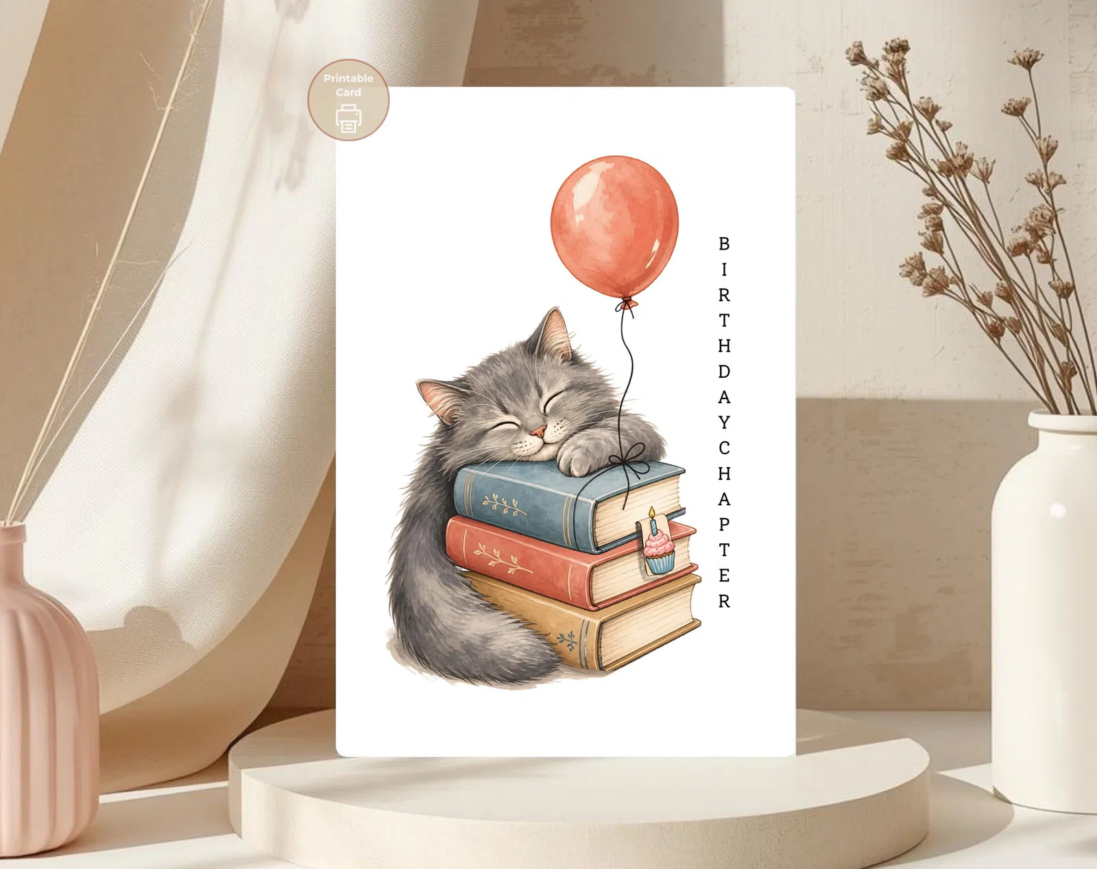 Styled product mockup: A cozy printable birthday card for cat lovers, bookworms, and quiet celebration people.