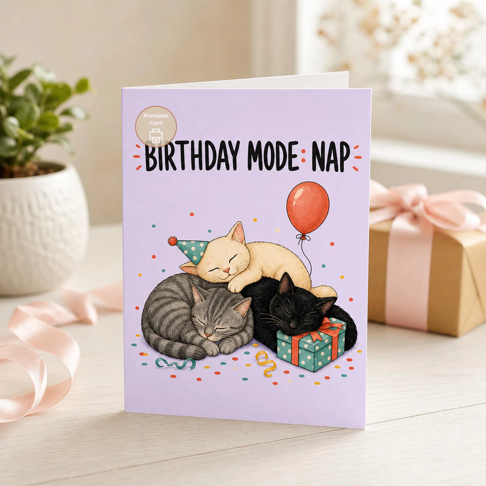 Styled product mockup: A cozy printable birthday card for cat lovers who know a good nap can be the best party plan.