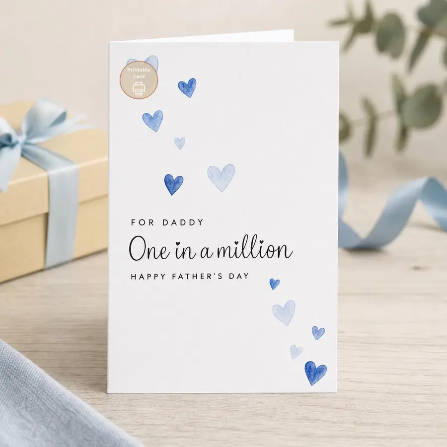 Styled product mockup: Celebrate Dad with a sweet Father's Day printable card featuring blue watercolor hearts and the message One in a million.